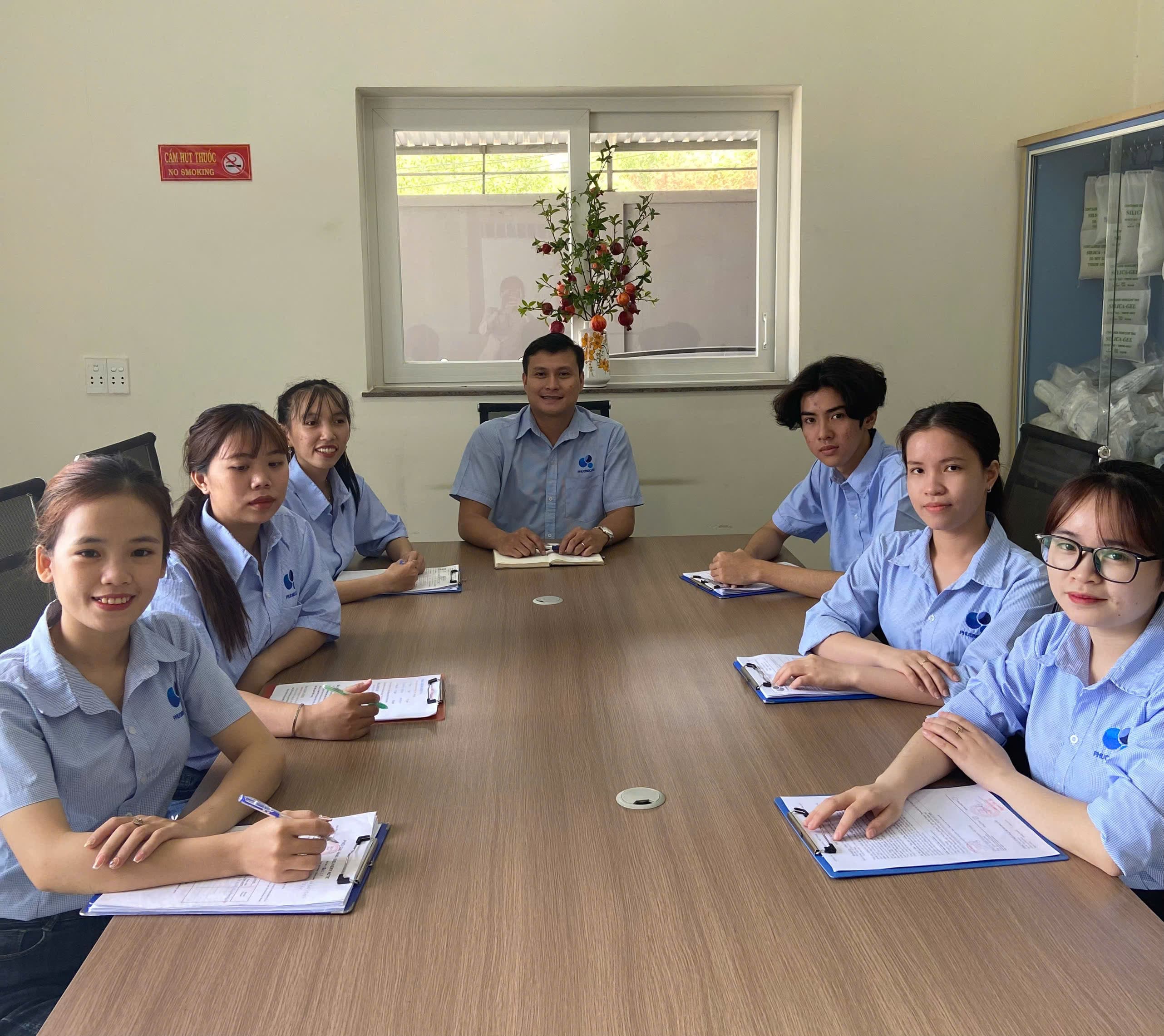 Phuong Cat employees meeting and discussing work at the office