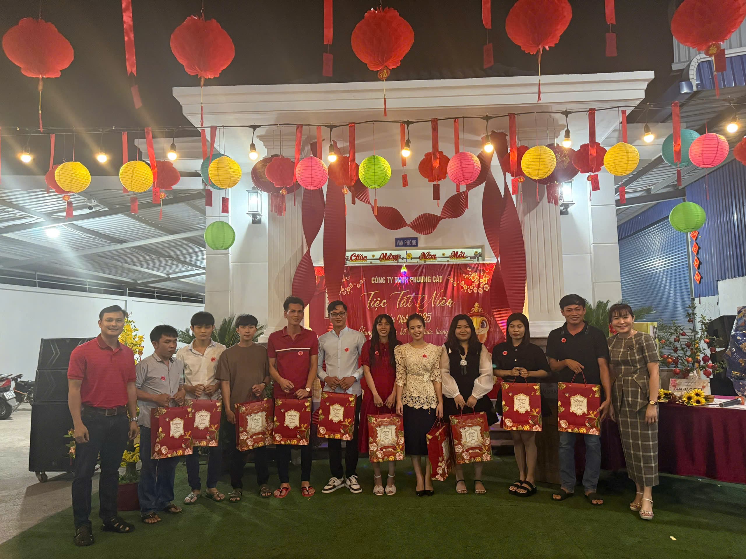 The Phuong Cat team receiving gifts at a year-end gathering