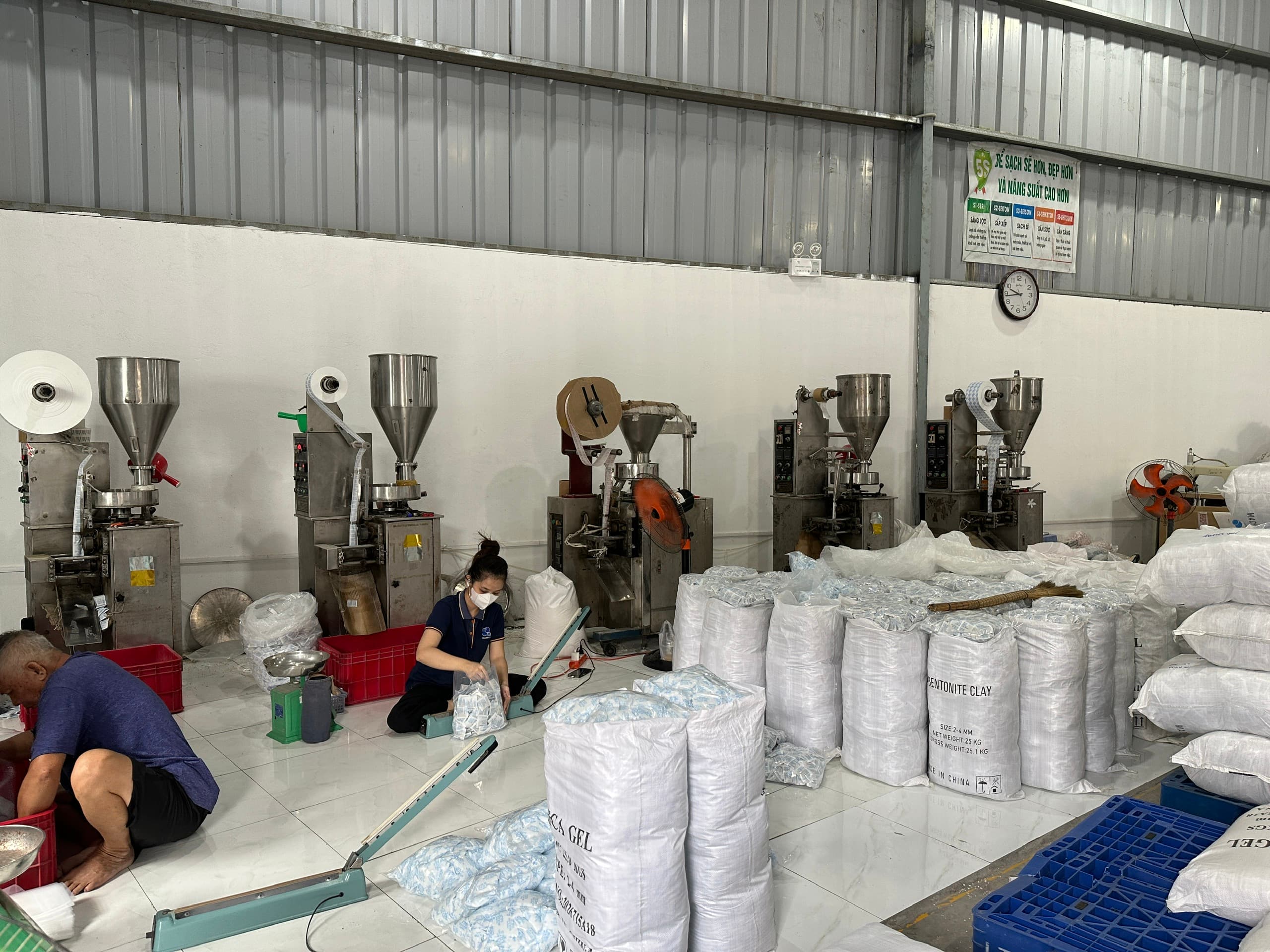 Silica gel and clay production area with packing machines and materials at the Phuong Cat factory
