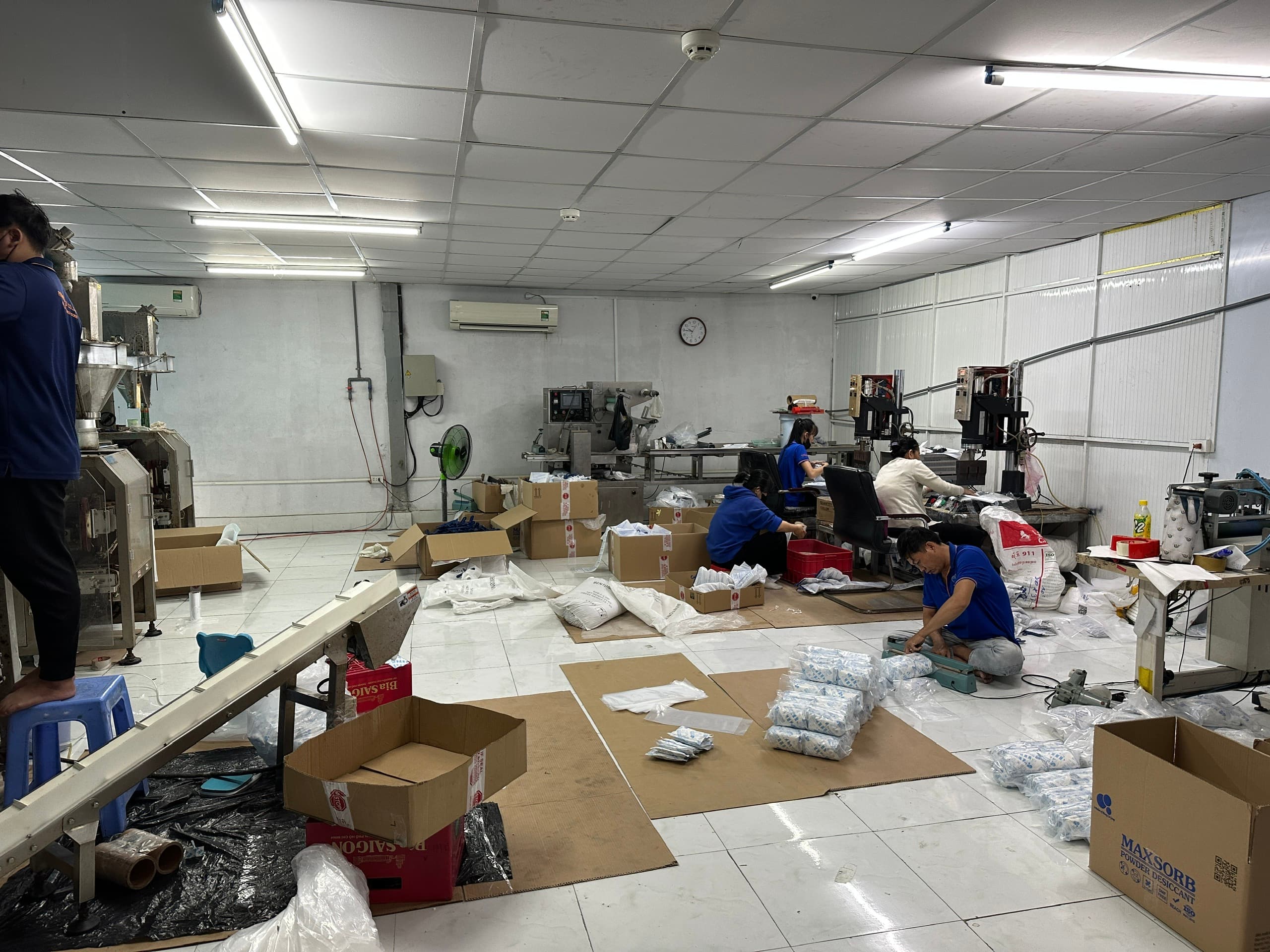 Staff packing MAXSORB powder in the Phuong Cat production area
